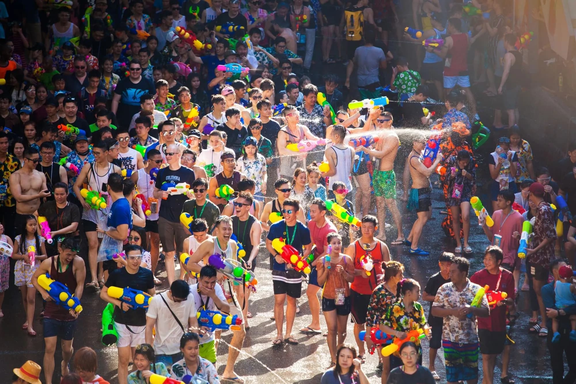 People celebrating Songkran with water splashes